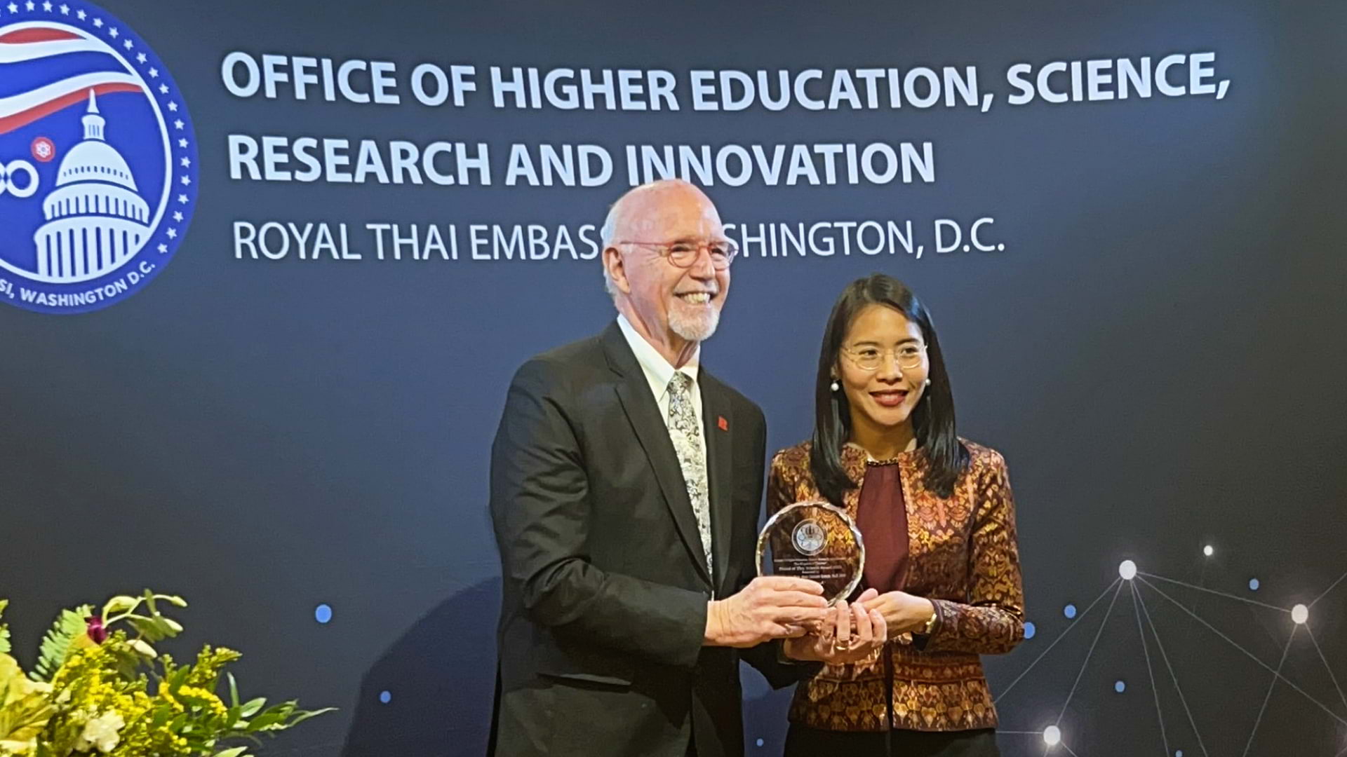 Mrk Robson and presenter holding a plaque